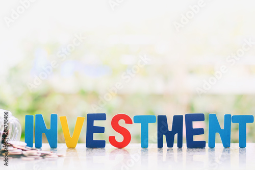 Investment wooden word with...