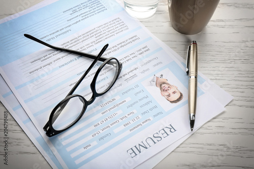 Resume forms and glasses on...