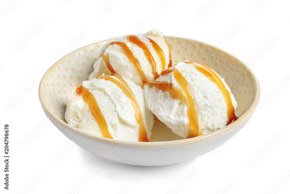 Tasty ice cream with caramel sauce in bowl on white background Tasty ice cream with caramel sauce in bowl on white background