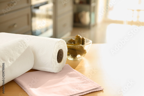 Rolls of paper towels on ki...