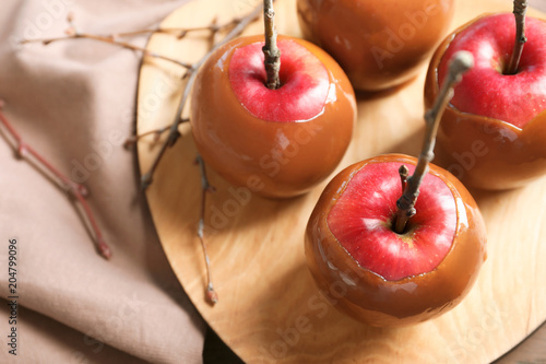 Plate with delicious caramel apples, closeup