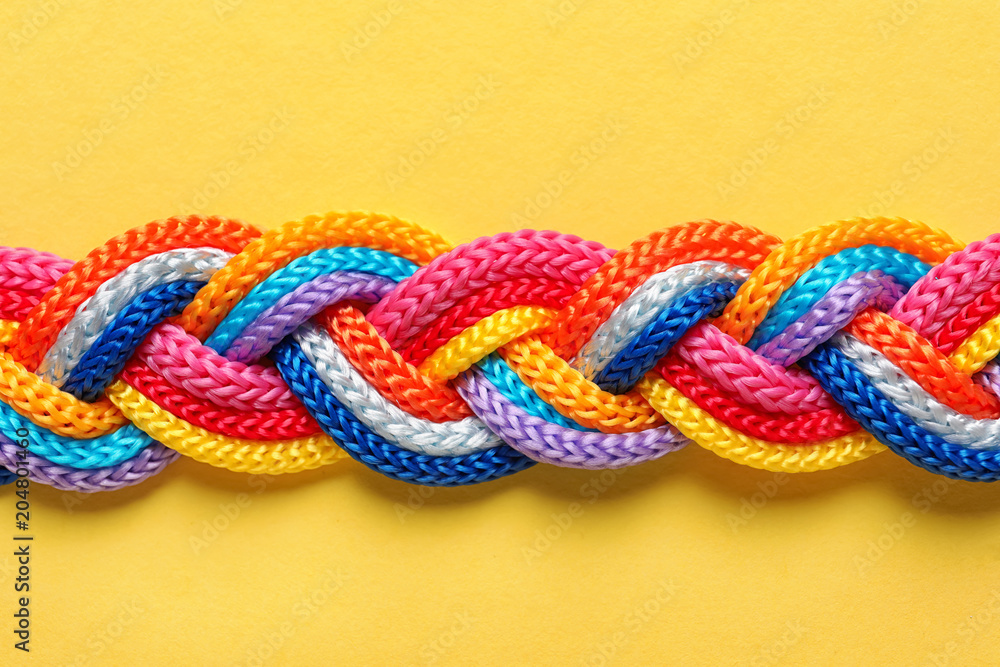 Braided ropes on color background, top view. Unity concept Braided ropes on color background, top view. Unity concept
