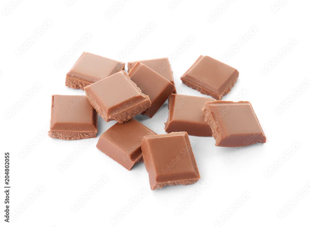 Delicious milk chocolate pieces on white background Delicious milk chocolate pieces on white background