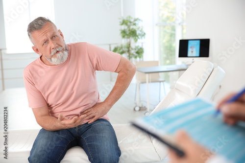 Papier peint Man with health problem visiting urologist at hospital