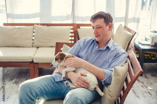 Man with dog at home