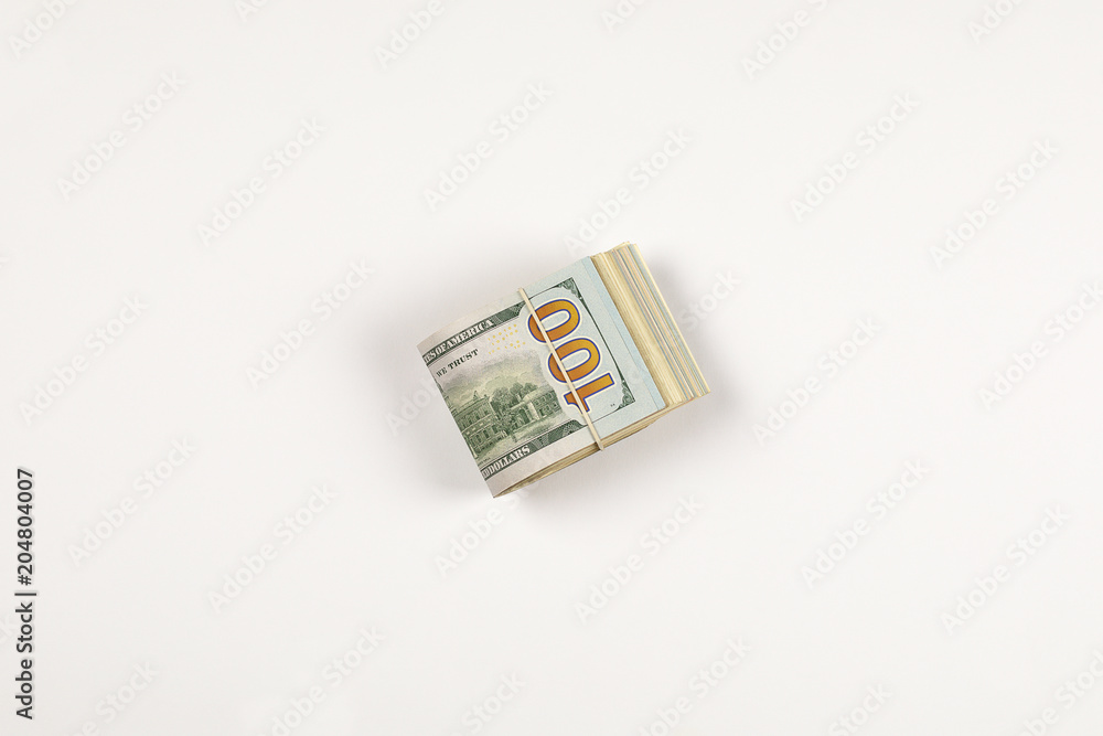 Stack of USA 100 dollars isolated on white background. Stack of USA 100 dollars isolated on white background.