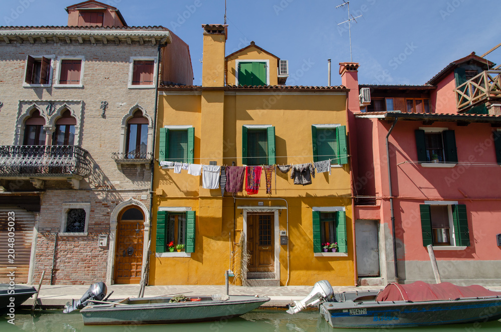 Typical houses by the canal in Burano near Venice