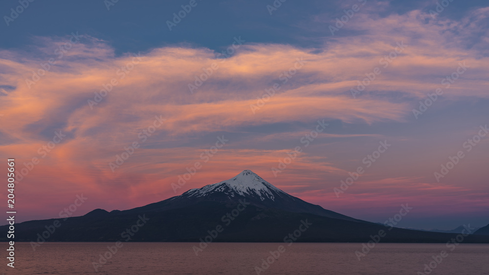 Beautiful sunset at a viewpoint in Ensenada located opposite the Osorno volcano, Puerto Varas, southern Chile