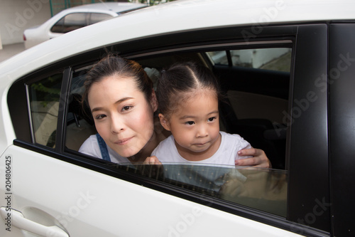 happy little girl with family sitting in the car © Sataporn