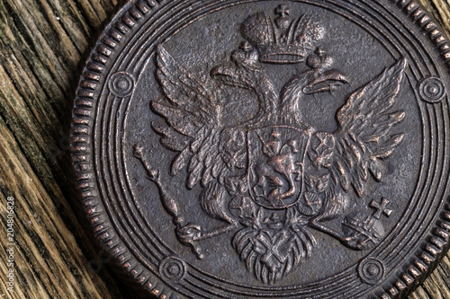 old copper Russian coin 5 kopecks 1804 edition on a wooden old table, copper coin