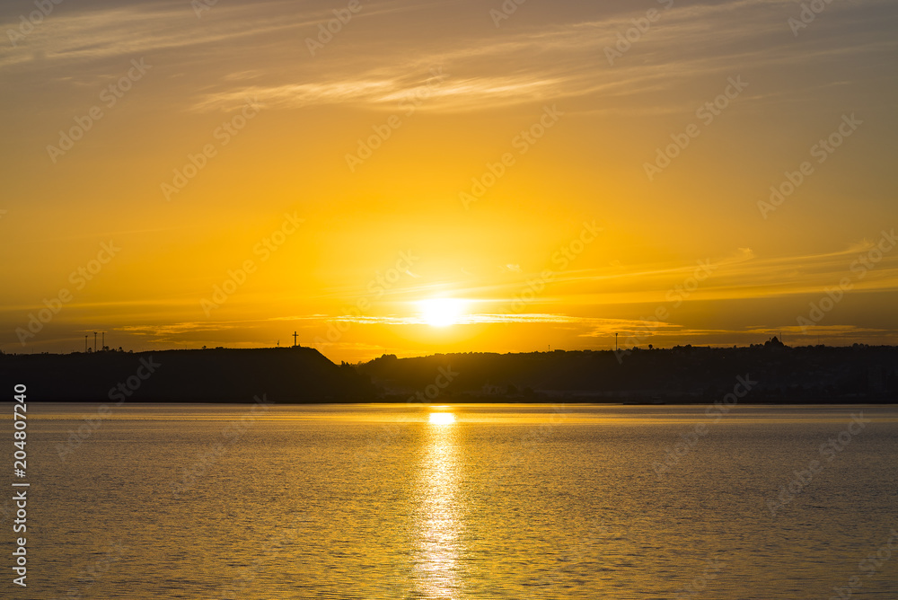 Sunset and colors at the City of Puerto Montt, Chile. Tenglo island and the harbour are in frame