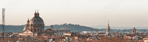 View of Rome roofs: Spire of Saint Ivo alla Sapienza, Towerbell of Saint Augustine Church, church dome of San Carlo at Cantinari, Sant'Andrea of Valle Sant'Agnese in Agone photo