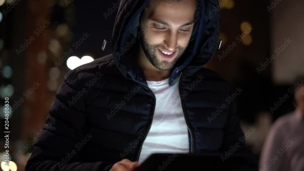 Portrait of a Guy using tablet at night Portrait of a Guy using tablet at night