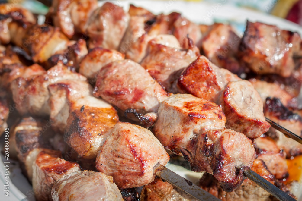 Grilled shish kebab or shashlik pork on skewers closeup. Grilled shish kebab or shashlik pork on skewers closeup.