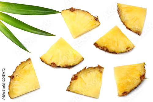 healthy background. pineapple slices with green leaves isolated on white background top view