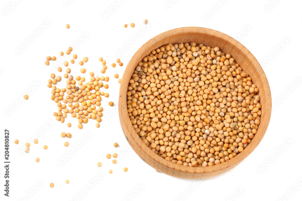 mustard seeds in wooden bowl isolated on white background. top view mustard seeds in wooden bowl isolated on white background. top view
