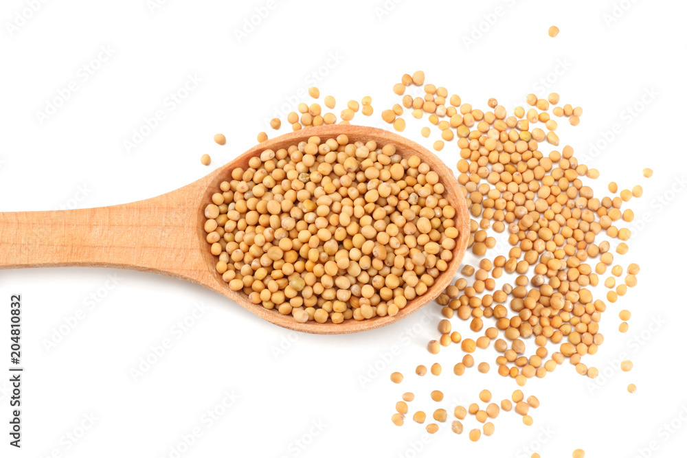 mustard seeds in wooden spoon isolated on white background. top view mustard seeds in wooden spoon isolated on white background. top view