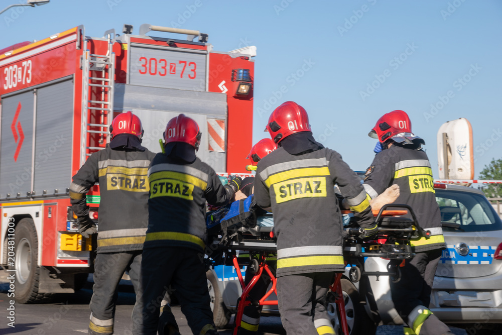 Obraz premium Szczecin, Poland-May 13, 2018: police, fire brigade and medical services during a rescue operation after drowning in a river
