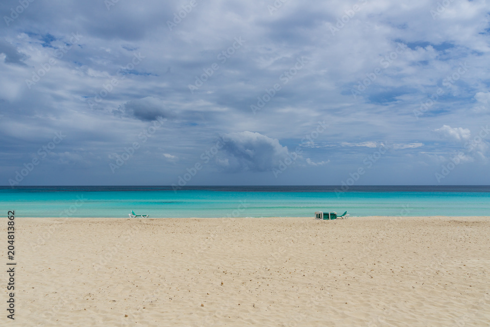 Mallorca, Perfect blue water on beach paradise with canvas chairs Mallorca, Perfect blue water on beach paradise with canvas chairs