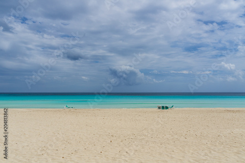Fototapeta Naklejka Na Ścianę i Meble -  Mallorca, Perfect blue water on beach paradise with canvas chairs