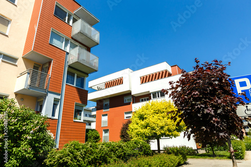 Exterior of a modern apartment buildings on a blue sky background.