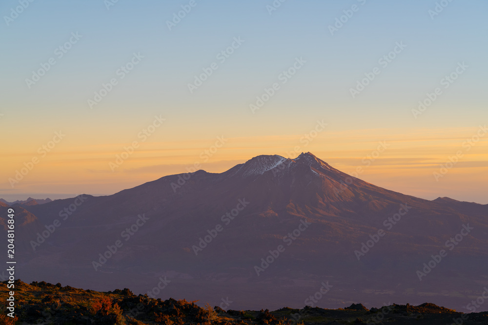 Sunset photography with a view of the Calbuco volcano, from the heights of the Osorno volcano. South of Chile