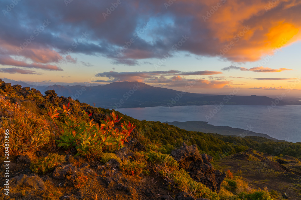 Landscape of the slopes of the volcano Osorno, in the background you can see the Calbuco Volcano and the Llanquihue Lake. South of Chile