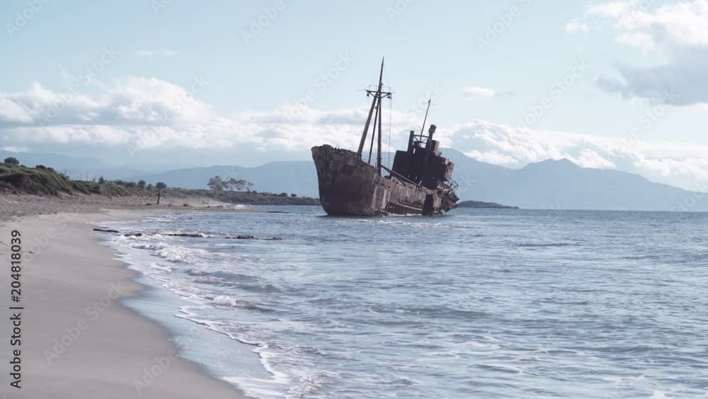 Greek coastline with the famous rusty shipwreck in Glyfada beach near Gytheio, Gythio Laconia Peloponnese Greece 4K