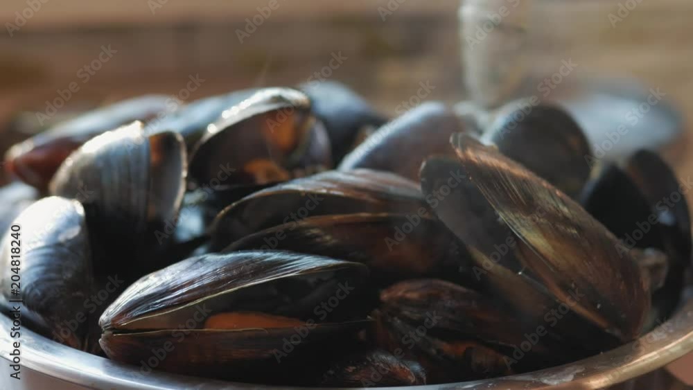 cook sea shellfish. mussels with garlic sauce. sea food cook sea shellfish. mussels with garlic sauce. sea food