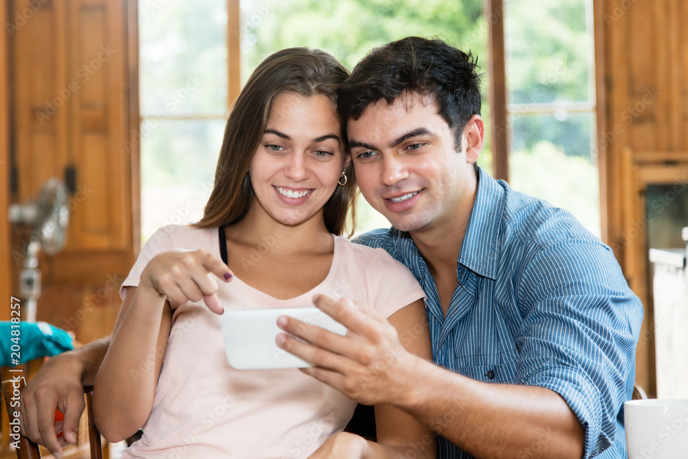 Love couple watching tv on cellphone Love couple watching tv on cellphone