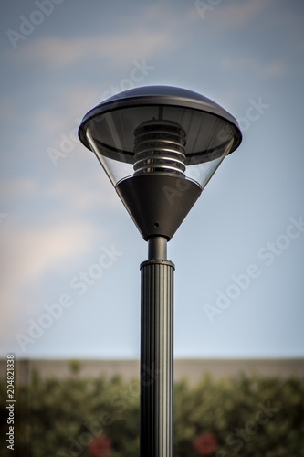 Modern led Street Pole light. Street pole and light fixture against a blue sky background