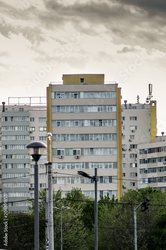 Bad weather coming to the town. Apartment complex in Bucharest and cloudy sky
