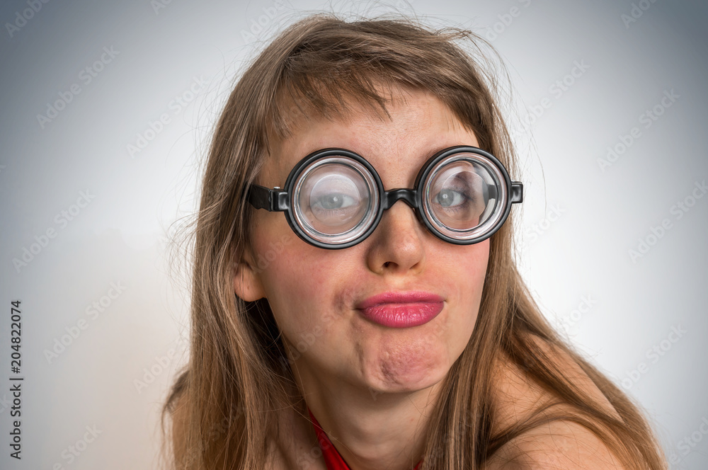 Funny nerd or geek woman with sexual expression on face Funny nerd or geek woman with sexual expression on face