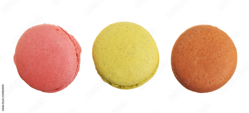 colored macaroons isolated on white background without a shadow closeup. Top view. Flat lay colored macaroons isolated on white background without a shadow closeup. Top view. Flat lay