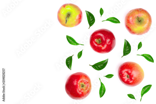 red apples decorated with green leaves isolated on white background with copy space for your text, top view