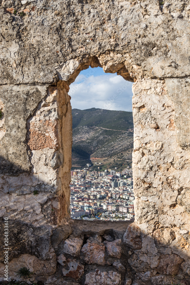 Window in a medieval castle wall with the view over Mediterranea