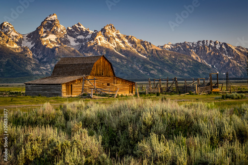 CLOSE VIEW OF MORMON ROW BARN AND THE GRAND TETONS WYOMING