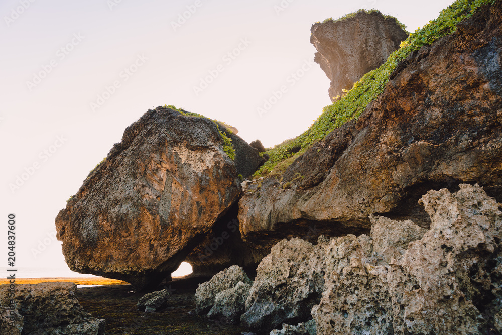 Cliff with rocks, stones and sunset colors in Bali Cliff with rocks, stones and sunset colors in Bali