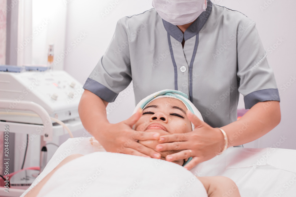 beautician giving facial massage beautician giving facial massage