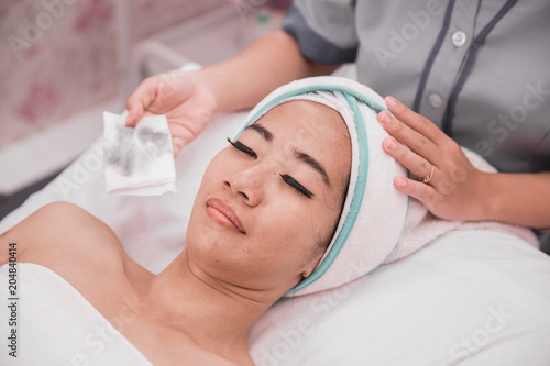 woman facial care in beauty salon and spa