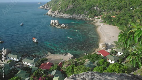 Overview of amazing Tanote Bay with his beautiffull coral reef, huge granite blocks and boats at anchor in pure clear water, Koh Tao, Thailand photo