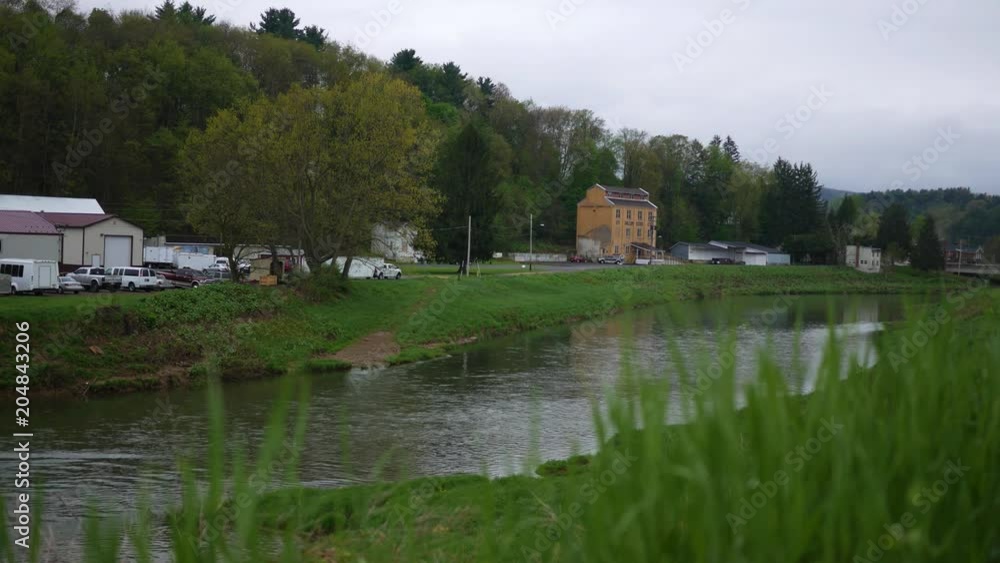 A daytime establishing shot of small american town on overcast day A daytime establishing shot of small american town on overcast day
