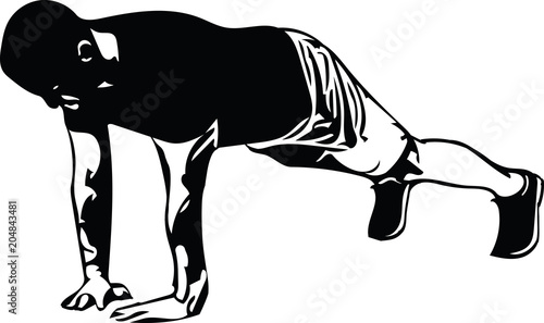 Active young man doing push-ups in gym