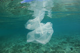 Plastic pollution in ocean. Plastic bags, bottles and straws pollute sea