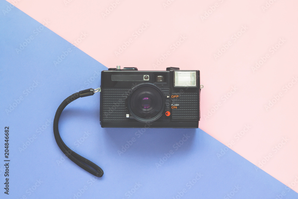 Close up camera film on pastel colors background, Vintage color filter