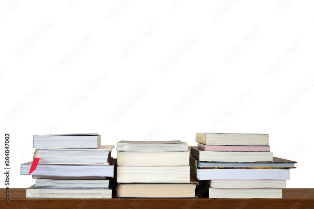 Piles or stack of books for reading and study on wooden shelf on white blank wall background Piles or stack of books for reading and study on wooden shelf on white blank wall background