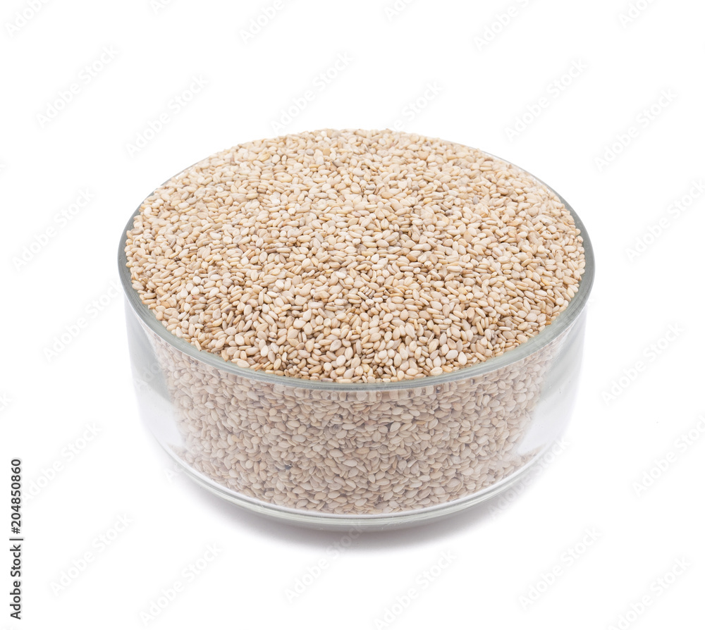 Natural Sesame Seeds in Glass Bowl Also Know as Til in India isolated on White Background Natural Sesame Seeds in Glass Bowl Also Know as Til in India isolated on White Background
