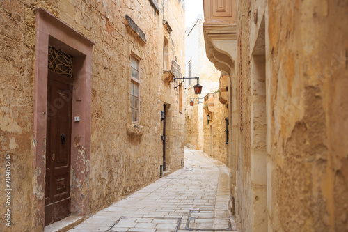 Fototapeta Naklejka Na Ścianę i Meble -  Mdina the old town with cobblestone streets, lanterns, peeled buildings, in Malta. Perfect destination for vacation and tourism.