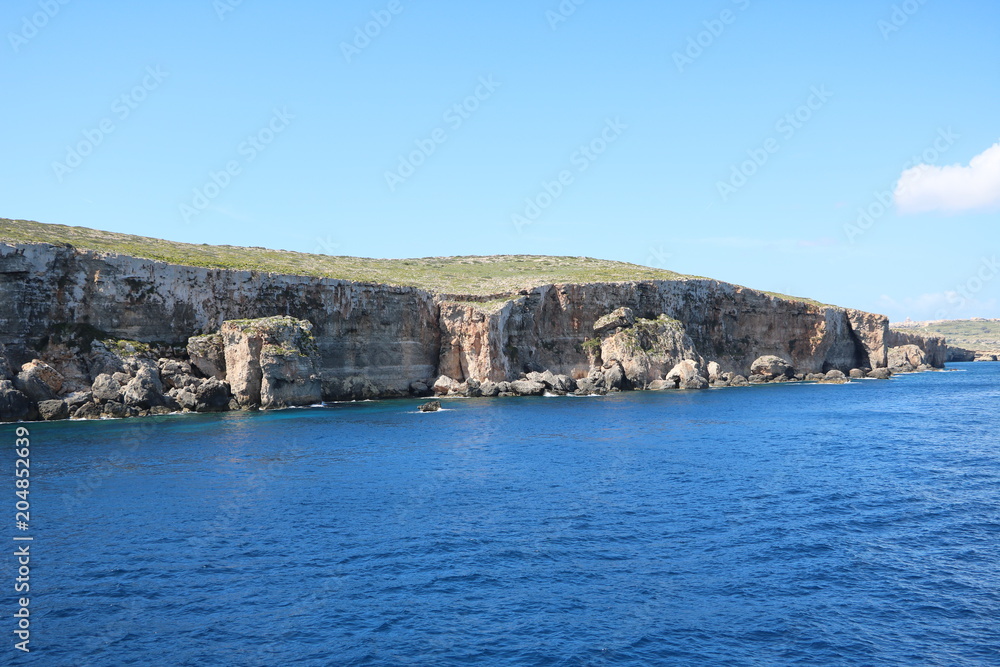 Coastline of Comino island of Malta at Mediterranean Sea 