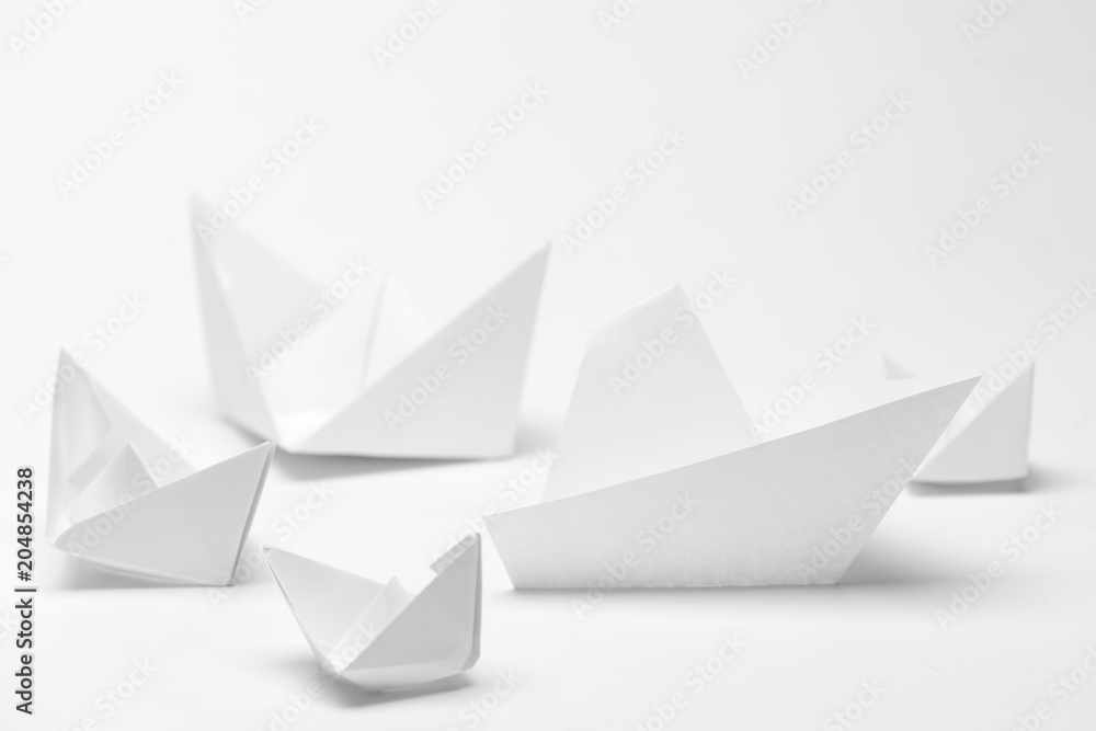 Set of origami paper boats. Leadership and business concept Set of origami paper boats. Leadership and business concept